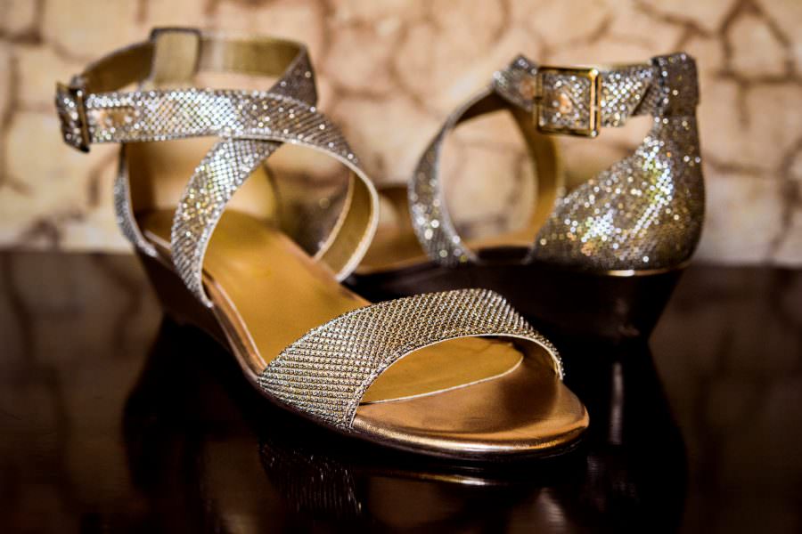 bride's shoes at wedding at Convento de las Capuchinas and reception at San Jose El Viejo in Antigua, Guatemala.