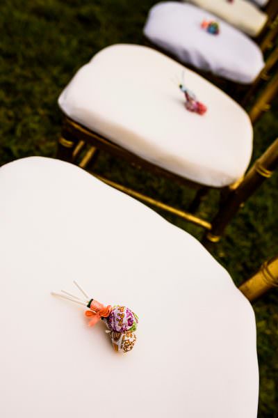 flowers on seats at wedding at Convento de las Capuchinas and reception at San Jose El Viejo in Antigua, Guatemala.