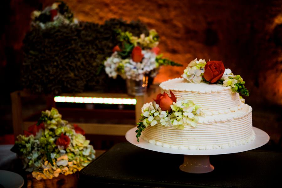wedding cake beautiful lighting at wedding reception at San Jose El Viejo in Antigua, Guatemala.