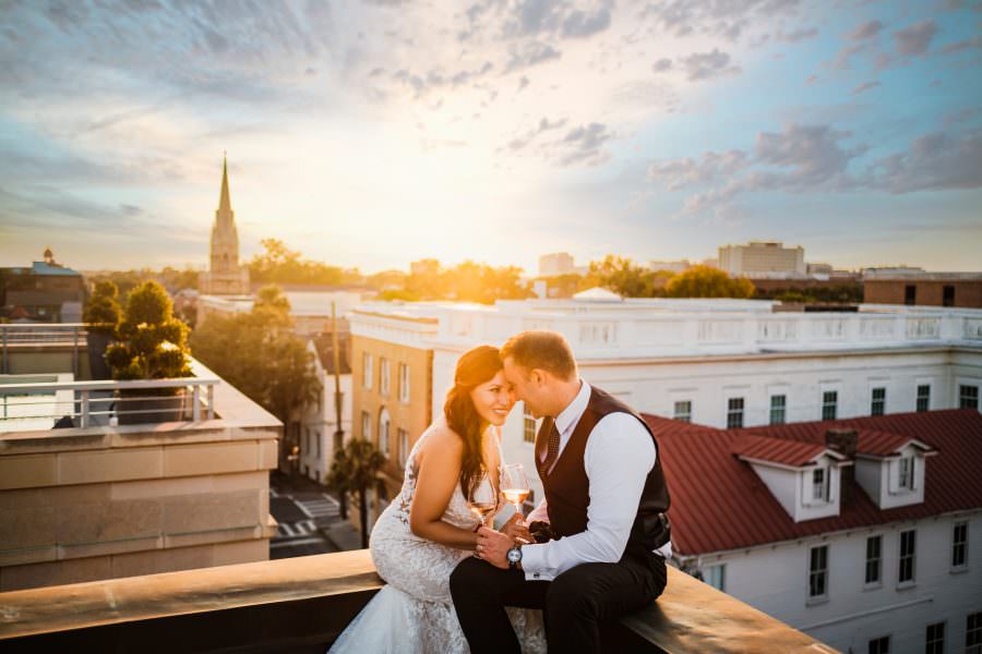 destination wedding portrait at The Restoration Hotel overlooking downtown Charleston