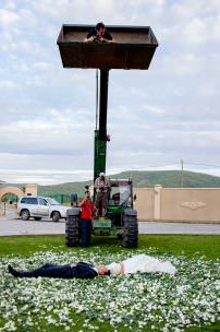 Destination wedding photographer Ben Chrisman photographs from the top of a tractor in Mongolia.